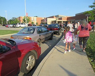 Neighbors | Jessica Harker.Dozens of cars lined the side walk up to Austintown Elementary School for the first day of classes.
