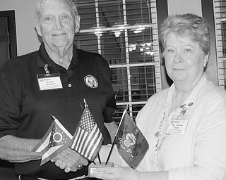 Neighbors | Submitted.Jim Cardamon is pictured receiving a flag set from MSVC-MOAA President Florence Hosler. Cardamon is an Army Veteran and former Sentinel at the Tomb of the Unknowns at Arlington National Cemetery.
