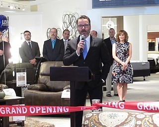 Neighbors | Jessica Harker.Chris Pelcher, the Executive Vice President of Levin Furniture, spoke at the grand opening event of the Levin's Boardman store.