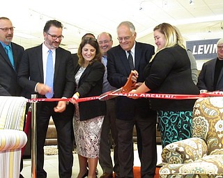 Neighbors | Jessica Harker.Levin Furniture employees cut the ribbion officially opening the new store at 300 Boardman-Poland road August 30.