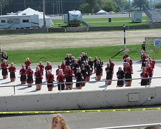 Neighbors | Jessica Harker.Members of the Canfield Cheerleading Squad performed cheers along with stunts during the Cheerleading Demonstrations at the Canfield Fair August 29.