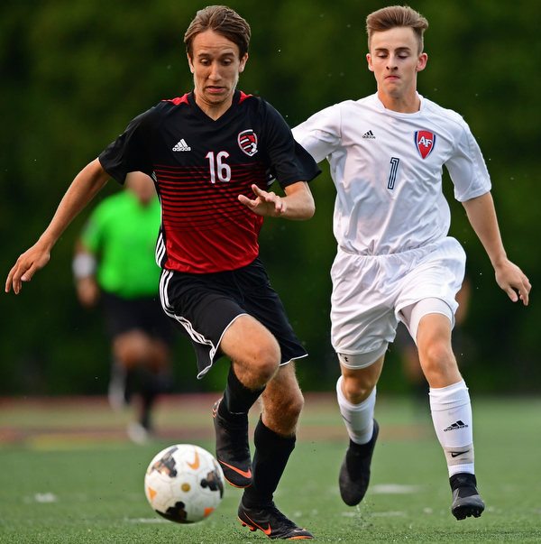 CANFIELD, OHIO - SEPTEMBER 6, 2018: Canfield's Matt Beck plays the ball ahead of Fitch's Andrew Lescsak during the first half of their game, Thursday night at Canfield High School. DAVID DERMER | THE VINDICATOR