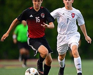 CANFIELD, OHIO - SEPTEMBER 6, 2018: Canfield's Matt Beck plays the ball ahead of Fitch's Andrew Lescsak during the first half of their game, Thursday night at Canfield High School. DAVID DERMER | THE VINDICATOR