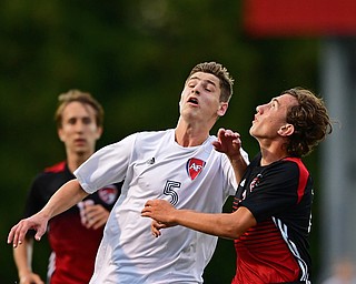 CANFIELD, OHIO - SEPTEMBER 6, 2018: Fitch's Dom Foley and Canfield's Nicholas Goodrich battle for the ball during the first half of their game, Thursday night at Canfield High School. DAVID DERMER | THE VINDICATOR