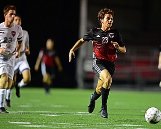 CANFIELD, OHIO - SEPTEMBER 6, 2018: Canfield's Mike Mecure dribbles away from Fitch's Zack Glavic during the second half of their game, Thursday night at Canfield High School. DAVID DERMER | THE VINDICATOR