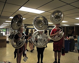 Neighbors | Jessica Harker.Three high school students posed with their new tubas, recently purchased by the Austintown Band Parents Association, on Aug. 1 at Fitch's annual band camp.