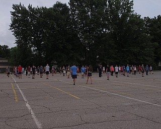 Neighbors | Jessica Harker.The full Austintown marching band, composed of 140 students, practiced marching in the parking lot as part of the Austintown band camp.