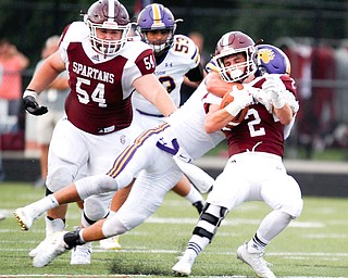 Jackson's Jake Ryan tackles Boardman's Joe Ieraci during the first half of their game Friday night at Boardman. EMILY MATTHEWS | THE VINDICATOR