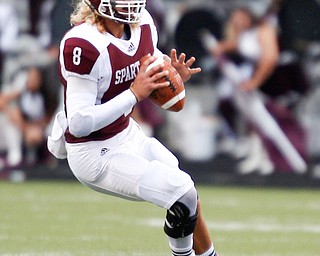 Boardman's Mike Ohoro gets ready to throw the ball during the first half of their game against Jackson Friday night at Boardman. EMILY MATTHEWS | THE VINDICATOR