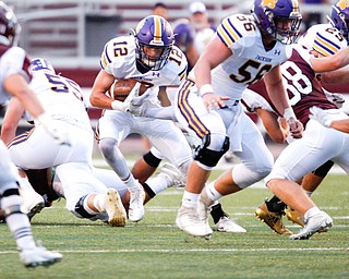 Jackson's Jake Ryan tries to get past Boardman during the first half of their game Friday night at Boardman. EMILY MATTHEWS | THE VINDICATOR