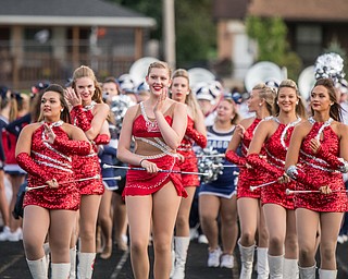 DIANNA OATRIDGE | THE VINDICATOR Niles majorettes lead the marching band into Struthers' stadium on Friday night.