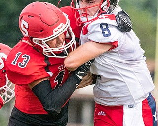 DIANNA OATRIDGE | THE VINDICATOR Struthers' Keith Burnside (13) brings down Niles' Zack Leonard (8) during their game in Struthers on Friday.