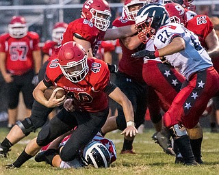 DIANNA OATRIDGE | THE VINDICATOR Struthers' Joseph Macciomei is tackled during their game against Niles on Friday night in Struthers.