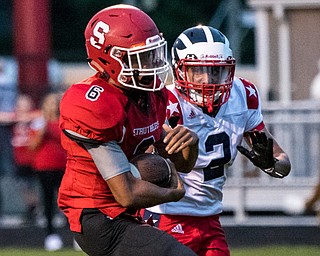 DIANNA OATRIDGE | THE VINDICATOR Struthers' Adrian Brown (6) rushes for a touchdown with Niles' Jayden Davis (2) in pursuit during their game in Struthers on Friday.