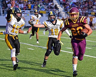 NORGH LIMA, OHIO - SEPTEMBER 7, 2018: South Range's Josh Stear runs for the corner before being knocked out at the one yard line while being chased by Crestview's Stephen Barr, left, and Austin Brodigan during the first half fo their game, Friday night at South Range High School. DAVID DERMER | THE VINDICATOR