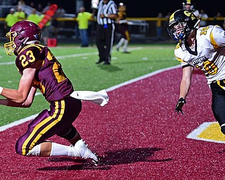 NORGH LIMA, OHIO - SEPTEMBER 7, 2018: South Range's Chris Brooks, left, catches a touchdown pass in front of Crestview's Austin Brodigan during the first half fo their game, Friday night at South Range High School. DAVID DERMER | THE VINDICATOR