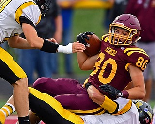 NORGH LIMA, OHIO - SEPTEMBER 7, 2018: South Range's Jacob Gehring falls into the end zone to score a touchdown after being brought down by Crestview's Dylan Huff and Nick Sherrill before falling into the end zone to score a touchdown during the first half fo their game, Friday night at South Range High School. DAVID DERMER | THE VINDICATOR