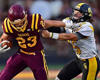 NORGH LIMA, OHIO - SEPTEMBER 7, 2018: South Range's Chris Brooks fights to break free from the grasp of Crestview's Stephen Barr during the first half fo their game, Friday night at South Range High School. DAVID DERMER | THE VINDICATOR