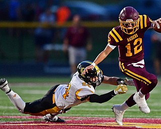 NORGH LIMA, OHIO - SEPTEMBER 7, 2018: South Range's Isaac Allegretto slips free from Crestview's Justin Collins during the first half fo their game, Friday night at South Range High School. DAVID DERMER | THE VINDICATOR