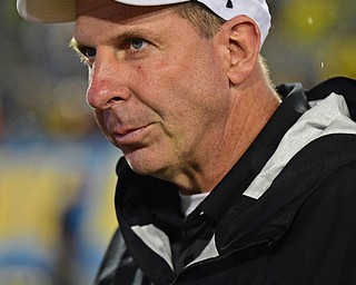 MORGANTOWN, WEST VIRGINIA - SEPTEMBER 8, 2018: Youngstown State head coach Bo Pelini walks off the field after Youngstown State was defeated 52-17 by West Virginia, Saturday night. DAVID DERMER | THE VINDICATOR