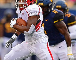 MORGANTOWN, WEST VIRGINIA - SEPTEMBER 8, 2018: Youngstown State's Tevin McCaster runs the ball runs the ball in the open field during the first half of their game, Saturday night. DAVID DERMER | THE VINDICATOR