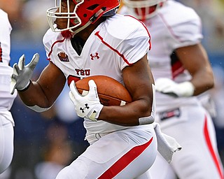 MORGANTOWN, WEST VIRGINIA - SEPTEMBER 8, 2018: Youngstown State's Tevin McCaster runs the ball runs the ball in the open field during the first half of their game, Saturday night. DAVID DERMER | THE VINDICATOR