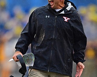 MORGANTOWN, WEST VIRGINIA - SEPTEMBER 8, 2018: Youngstown State head coach Bo Pelini shouts from the sideline during the first half of their game, Saturday night. DAVID DERMER | THE VINDICATOR