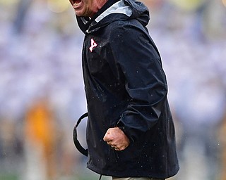 MORGANTOWN, WEST VIRGINIA - SEPTEMBER 8, 2018: Youngstown State head coach Bo Pelini shouts from the sideline during the first half of their game, Saturday night. DAVID DERMER | THE VINDICATOR