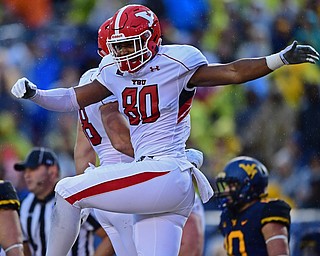 MORGANTOWN, WEST VIRGINIA - SEPTEMBER 8, 2018: Youngstown State's Miles Joiner celebrates after scoring a touchdown during the first half of their game, Saturday night. DAVID DERMER | THE VINDICATOR