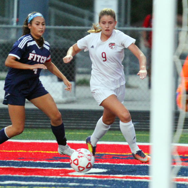 William D. Lewis The Vindicator  Canfield's Morgan Carey(9) and Fitch's Sarah Egolf (4).during 9-12-18 action at Fitch.