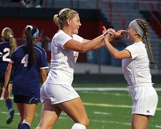 William D. Lewis The Vindicator  Canfield's Chloe Kalina(22) gets congratulated by Marisa Scheetz (5) after scoring  during 9-12-18 action at Fitch.
