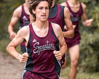 DIANNA OATRIDGE | THE VINDICATOR Boardman's Jackson Lipka leads a group of Spartan runners through the course during the Suburban Cross Country meet at Austintown Park on Tuesday.