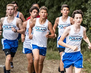 DIANNA OATRIDGE | THE VINDICATOR Members of the Poland boys cross country team run the course during the Suburban Cross Country meet at Austintown Park on Tuesday.