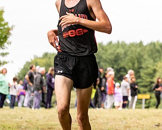 DIANNA OATRIDGE | THE VINDICATOR Howland's Lane Goble crosses the finish line in second place at the Suburban Cross Country meet at Austintown Park on Tuesday.