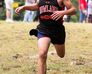 DIANNA OATRIDGE | THE VINDICATOR Howland's Jimmy Rollison crosses the finish line during the  Suburban Cross Country meet at Austintown Park on Tuesday.