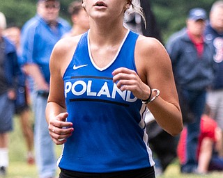 DIANNA OATRIDGE | THE VINDICATOR Poland's Gianna Stanich crosses the finish line in first place at the Suburban Cross Country meet at Austintown Park on Tuesday.