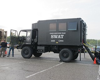 Neighbors | Jessica Harker.SWAT team vehicles were parked in the Austintown Park August 7 for the sixth annual National Night Out event.