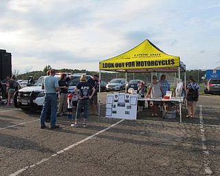 Neighbors | Jessica Harker.A tent dedicated to the Look Out for Motorcycles campaign was set up to educate people about motorcycle safety August 7 for the National Night Out event.