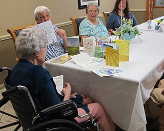 Neighbors | Jessica Harker.Betty Leo read the multitude of birthday cards sent to her August 14 to celebrate her 100th birthday.
