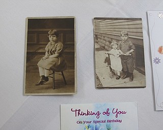 Neighbors | Jessica Harker.These old photos show Betty Leo was a young girl, one picture with her and one of her three brothers. These photos were on display during Betty's 100th birthday party August 14 at Brookdale Senior Living.