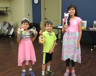 Neighbors | Jessica Harker.Zarah, Hassan and Sarah Rizvi hold the props that they used to perform in the first Be a Shining Star talent show on August 14.