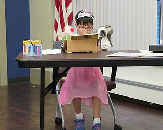 Neighbors | Jessica Harker.Zarah Rizvi performed an original puppet show on Aug. 14 at the "Be a Shining Star" talent show at the Boardman library.