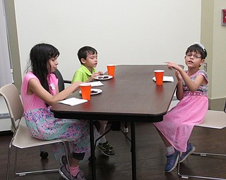 Neighbors | Jessica Harker.Sarah, Hassan and Zarah Rizvi enjoyed snacks after participating in the Be a Shining Star talent show on August 14.