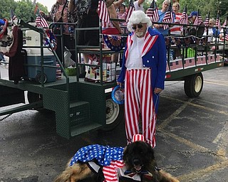 Neighbors | Submitted.Volunteer members of the Austintown Senior Center dressed up and rode on a float for the Fourth of July. The float won best non commercial float entry, which won the center a $100 check and a plaque.