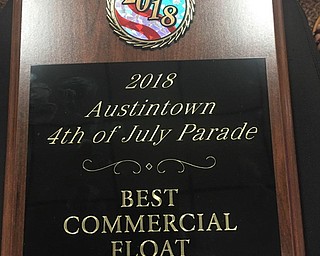 Neighbors | Submitted.The 2018 best commercial float plaque was given, along with a $100 check, to West Side Tire for their float during the Fourth of July parade.