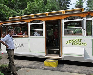 Neighbors | Jessica Harker.Trolley driver Bill helped community members board the Cohasset Express for the Fun Facts Trolley Tour of Mill Creek park on Aug. 22.