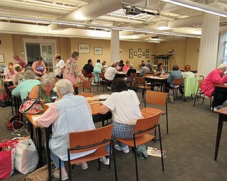 Neighbors | Jessica Harker.More than 25 people gathered at the Poland library on Aug. 21 to the create a holiday tree design provided by the Embroiderer's Guild of Youngstown.