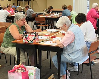 Neighbors | Jessica Harker.Participants worked on their holiday tree design projects at the Poland library event run by the Embroiderer's Guild of Youngstown on Aug. 21.