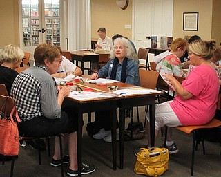 Neighbors | Jessica Harker.Participants worked on their holiday tree design projects at the Poland library on Aug. 21.