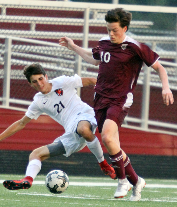 William D. Lewis The Vindicator  Boardman's Brian Yauger(10) and Howland'sDominic Malvasi(21) during 9-13-18 action at Boardman.